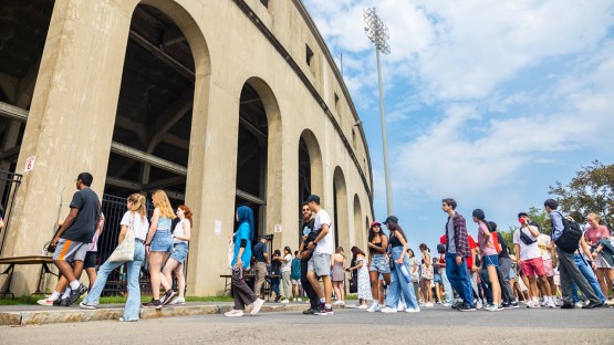 Students file into Schoellkopf Field for New Student Convocation