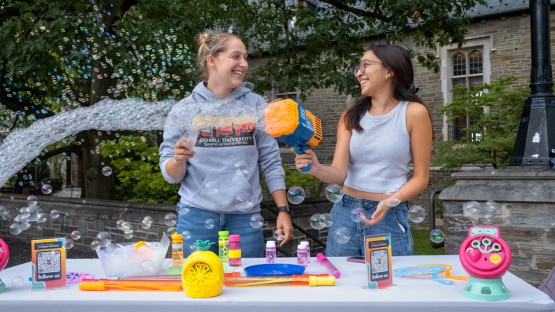 Cornell University Campus Activities Office sets up a table by Willard Straight Hall.