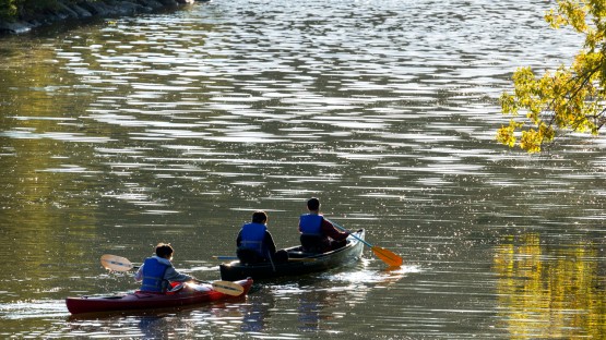 Cornell Outing Club members canoe on Beebe Lake.