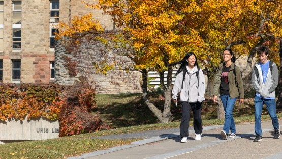 Students walk near Uris Library.