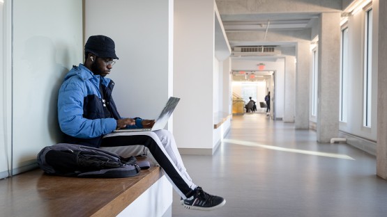 An engineering student works in Upson Hall.
