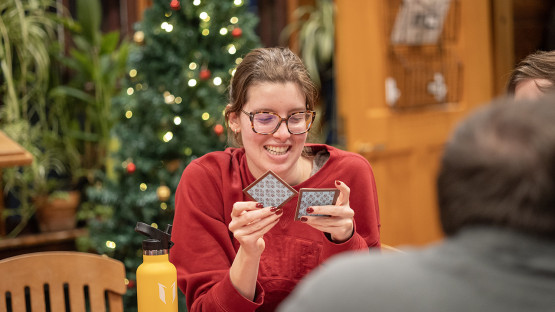 Students play a game in the Big Red Barn.