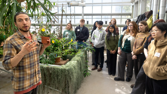 A tour group in the Liberty Hyde Bailey greenhouse