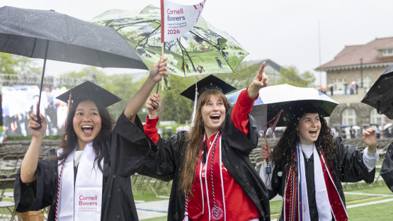 Students pointing and waving. 