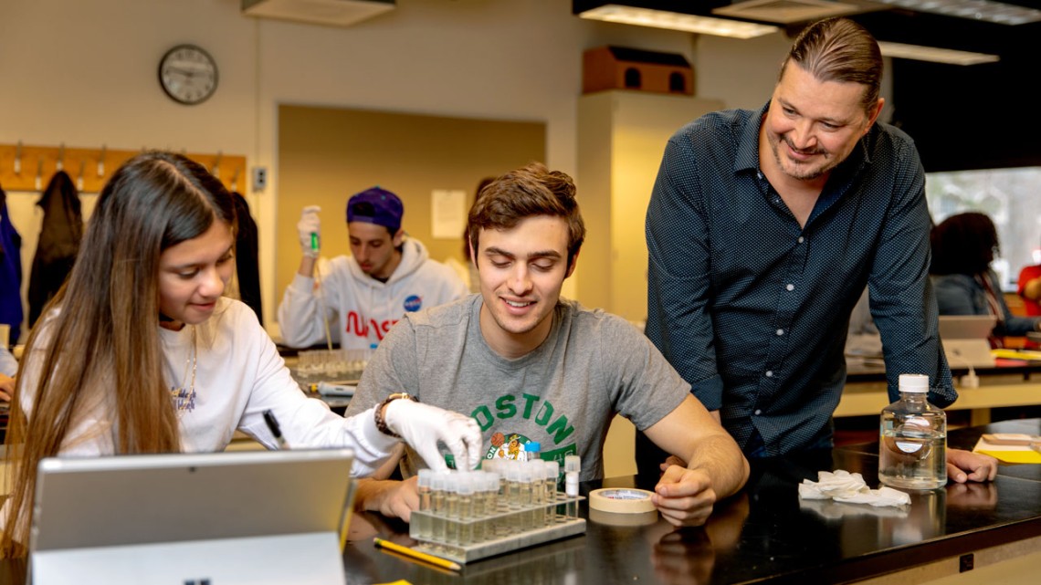 Mark Sarvary, right, observes students at work in the Investigative Biology Teaching Laboratories in 2019.