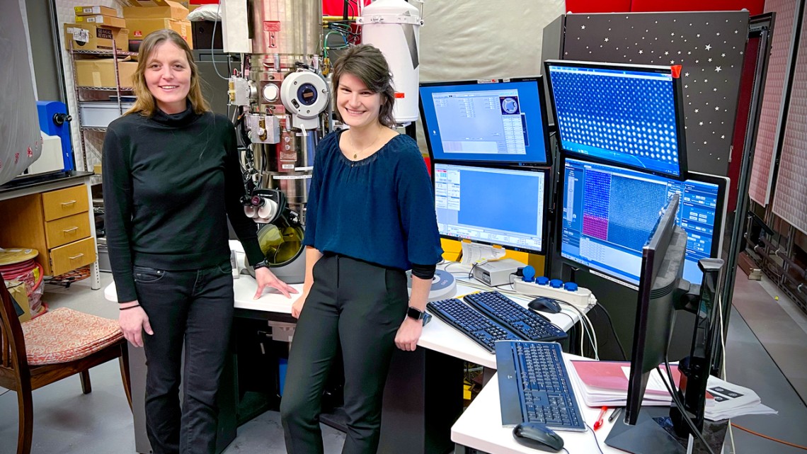 Lena Kourkoutis, left, associate professor of applied and engineering physics, and Berit Goodge, Ph.D. ’22, with the scanning transmission electron microscope.