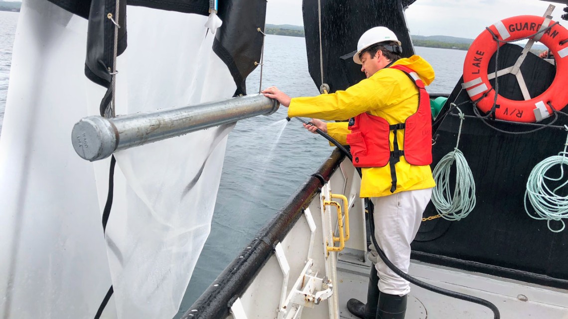 James Watkins retrieves a Tucker Trawl used for collecting fish larvae in Lake Ontario.