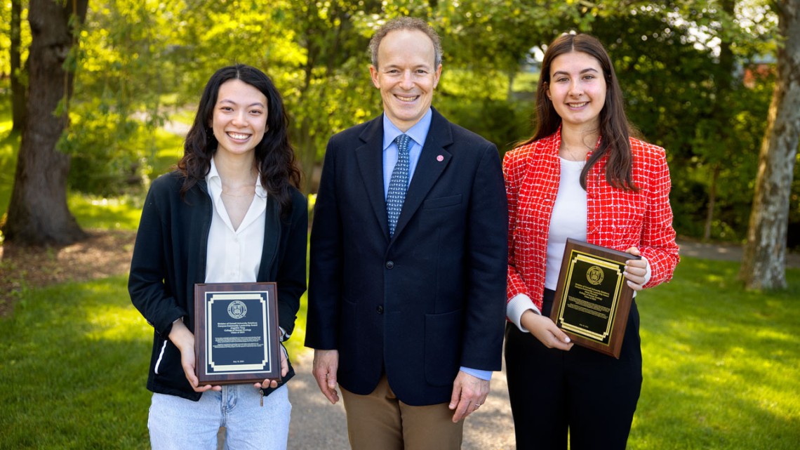 Joel M. Malina, vice president for university relations (center), presented graduating seniors Angelina Tang ’24 (left) and Alexa Plancher ’24 (right) with the 2024 University Relations Campus Community Leadership Award on May 16.