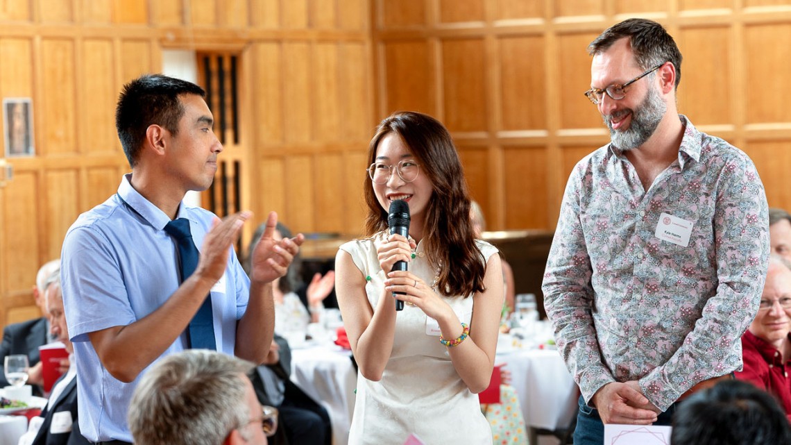 Kexin (Phyllis) Ju ’24, center, honors her high school mentor, Chuan Du of China, left, and her Cornell faculty mentor, Kyle Harms, right, a senior lecturer in the Department of Information Science, at the 36th Annual Merrill Presidential Scholars luncheon at Willard Straight Hall on Tuesday.