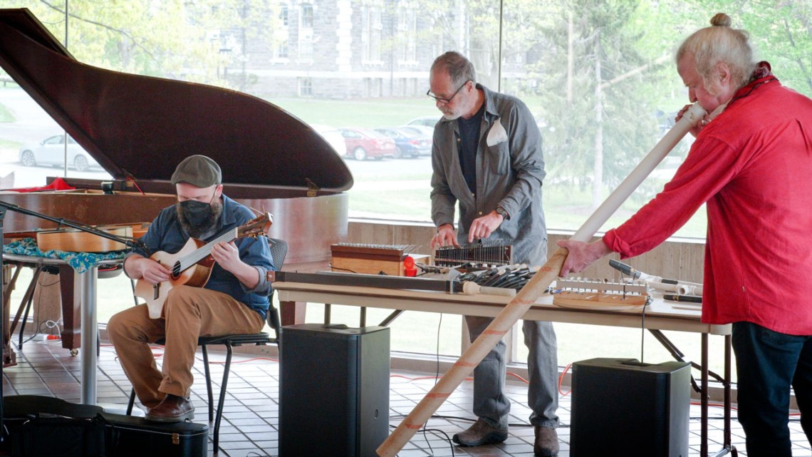 From left, Oberlin Composition Professor Jesse Jones, DMA ’12, instrument-designer and author Bart Hopkin, and multi-instrumentalist Mark Stewart improvise together in the Appel Lobby.