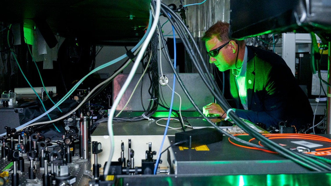 Chris Schaffer, professor of biomedical engineering, works with a laser configuration in his Weill Hall laboratory