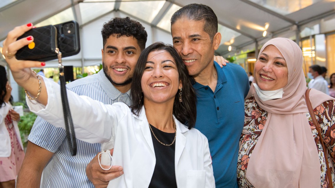Rana Barghout captures a moment with her family after receiving her white coat.