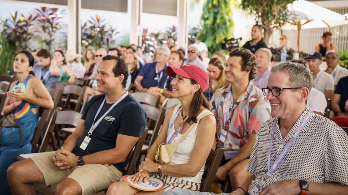 Group of audience members sitting at a BLISS Summit presentation