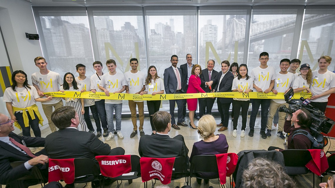 Abby, Howard ’73, and Michael ’11 Milstein cut a ribbon to celebrate the Cornell Tech launch of the Milstein Program in Technology and Humanity