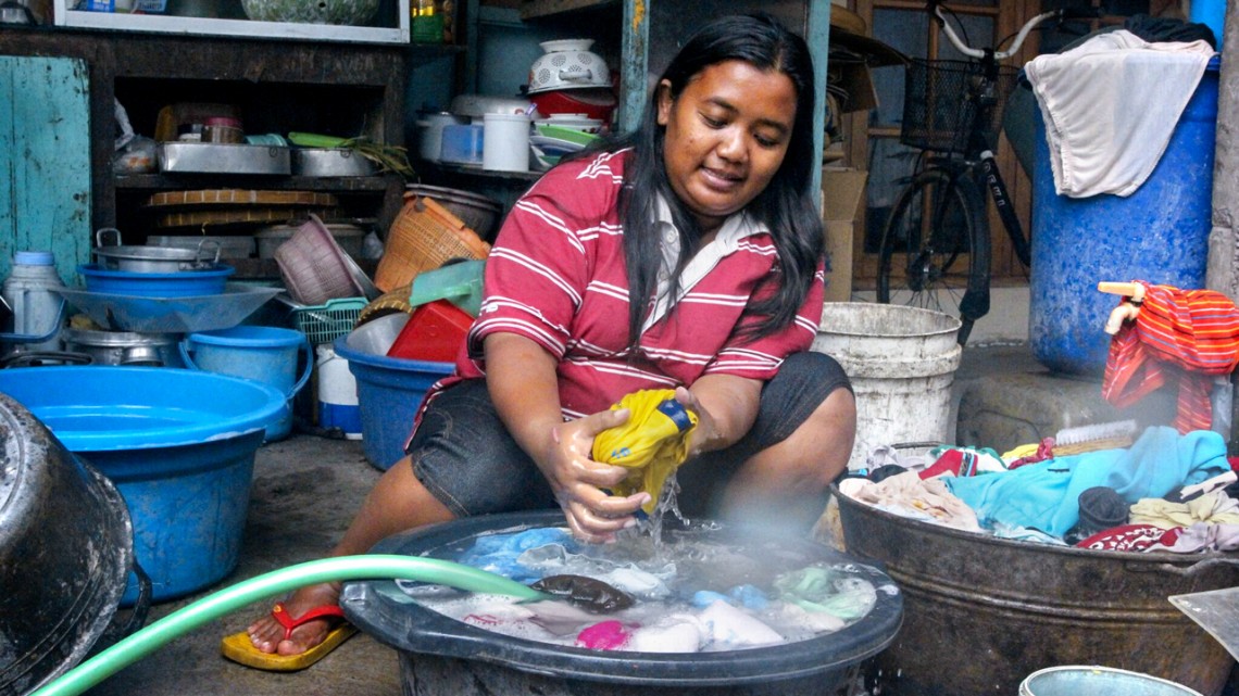 Indonesian woman doing laundry