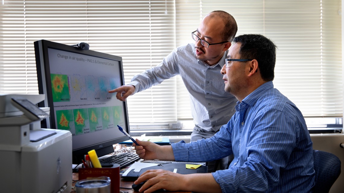Professor Oliver Gao studies air quality related to automobile emissions with researcher Shuai Pan.