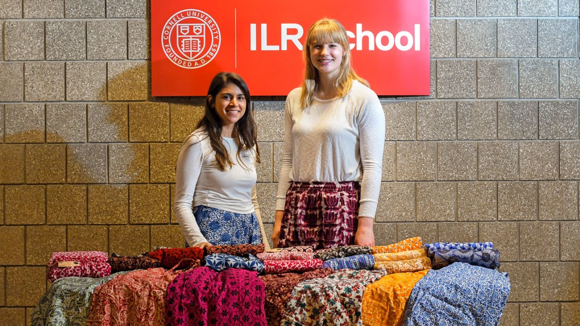 students pictured behind the table at a pop-up sale held in early March