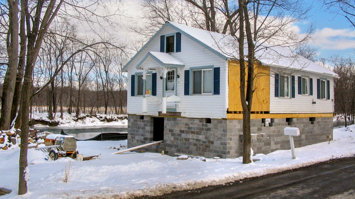 House being elevated to protect against flooding on Shawangunk Kill near the Hudson River in New York.