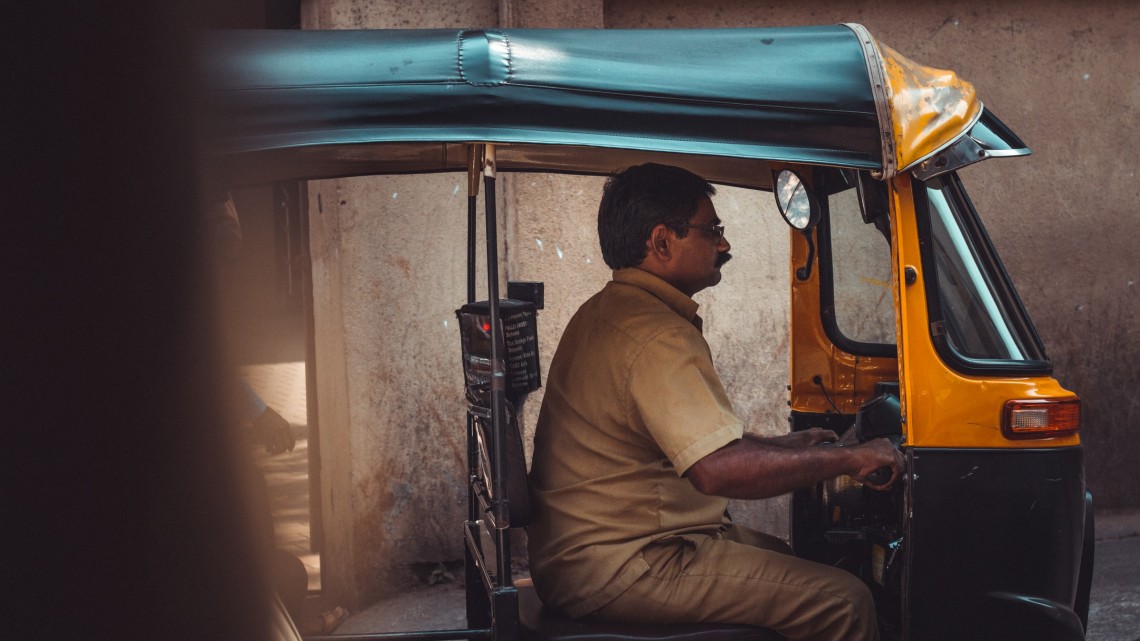 A man drives a taxi in India