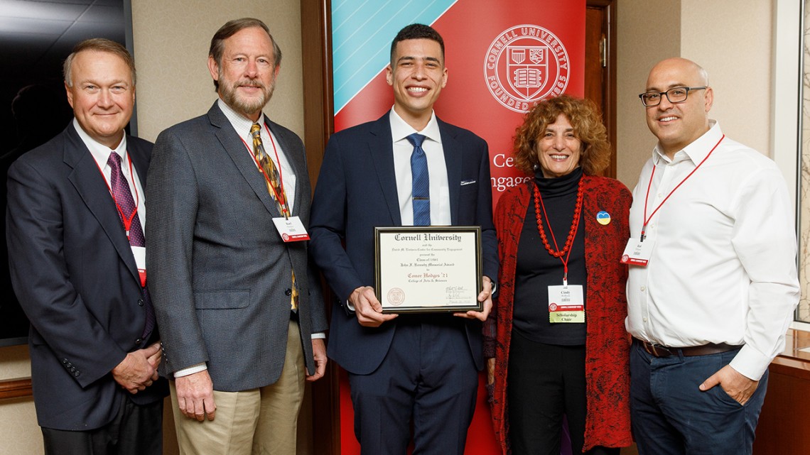 Left to right: Kraig Kayser MBA’84, Karl Hausker '79, Conor Hodges '21, Cindy Wolloch '64, and Itai Dinour '01 standing in line smiling. Conor is holding his certificate.