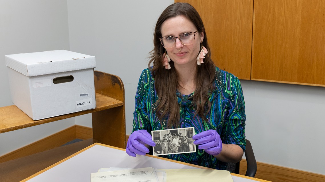 woman holding an old photograph