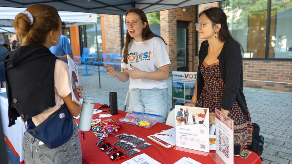 The nonpartisan student group Cornell Votes tables at Welcome Students Weekend on the Ithaca Commons..