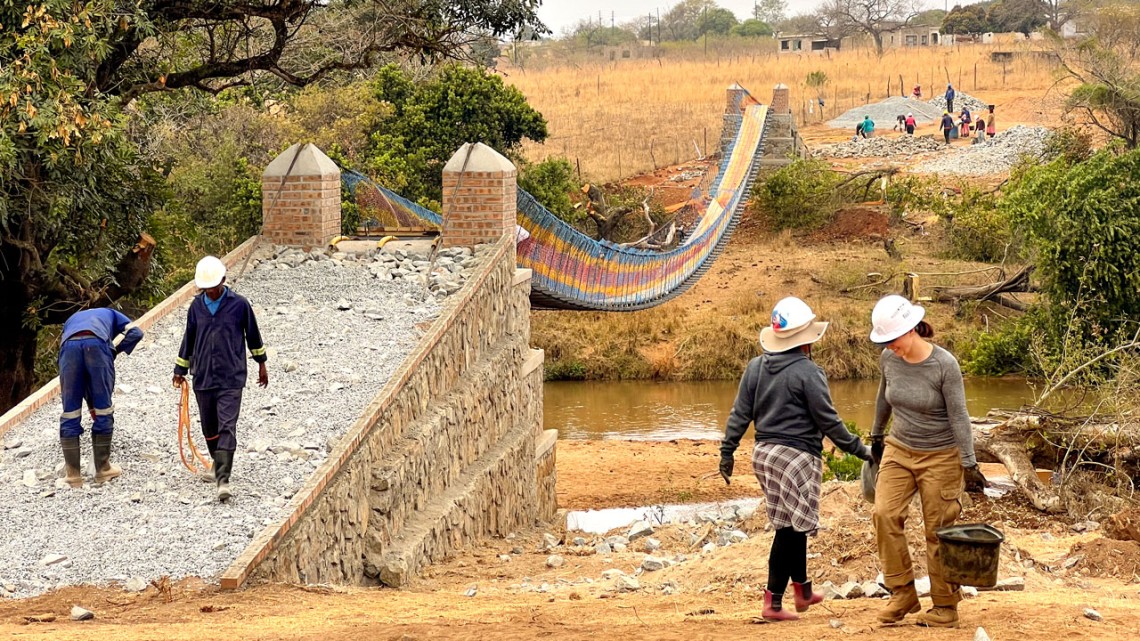 With the community, the 2024 Engineers in Action project team built a bridge over the Black Mbuluzi River.