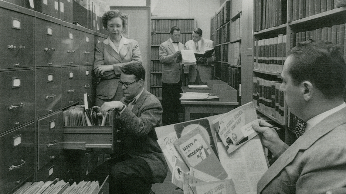 Archivist Lee Eckert helps researchers locate original materials in the library’s documentation center. 