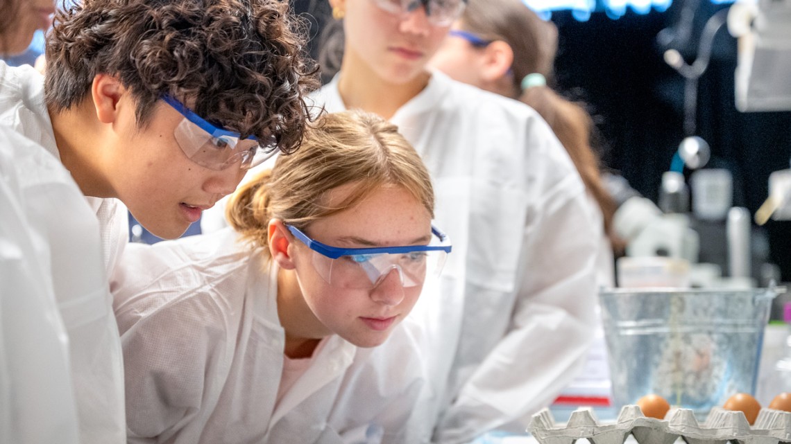 Brandon Hsieh, of New York City, and Sunny Zuger, of Washington County, participate in a lab activity session at 4-H Career Explorations June 26 in Weill Hall.