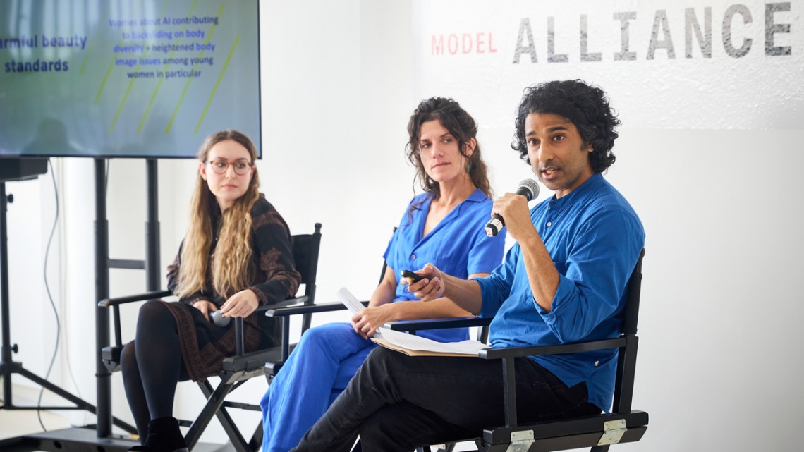 Sanjay Pinto, a fellow at the Worker Institute, speaks about the dangers of AI in the modeling industry at New York Fashion Week 2025, as his fellow researchers, from left, Alexandra Mateescu and Zoë West, look on.