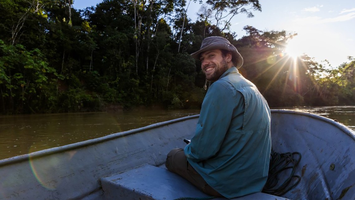 Ethan Duvall in a boat on the Amazon River