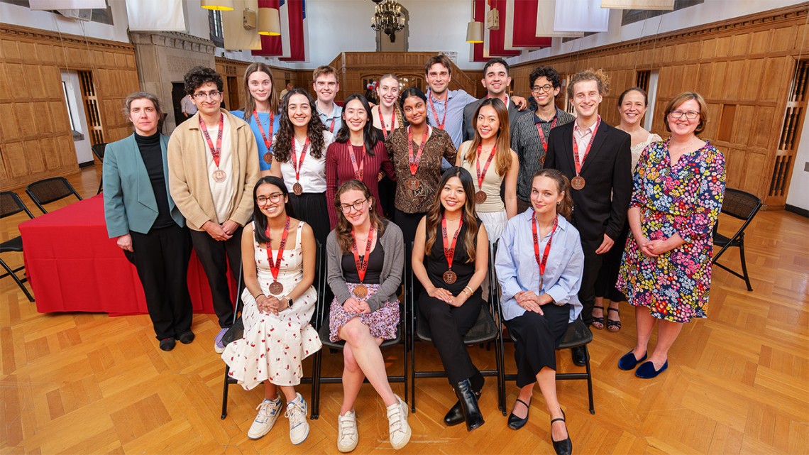 Cornell Spring Fellowship students post for a photo in the Memorial Room