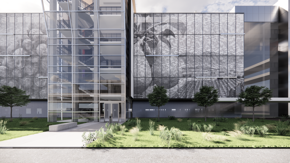 exterior of a parking garage covered in metal panels to create the image of an orchard