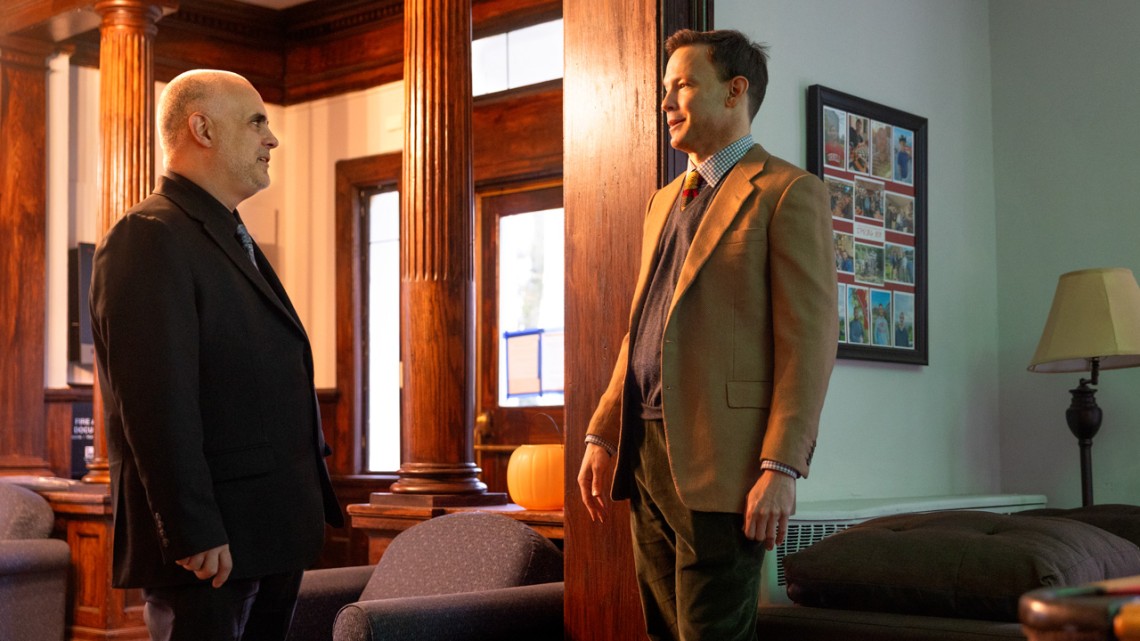 Thomas O'Toole, executive director of public affairs programming at the Brooks School, meets with student veteran Jess Warren in the Veterans House at 625 University Ave.