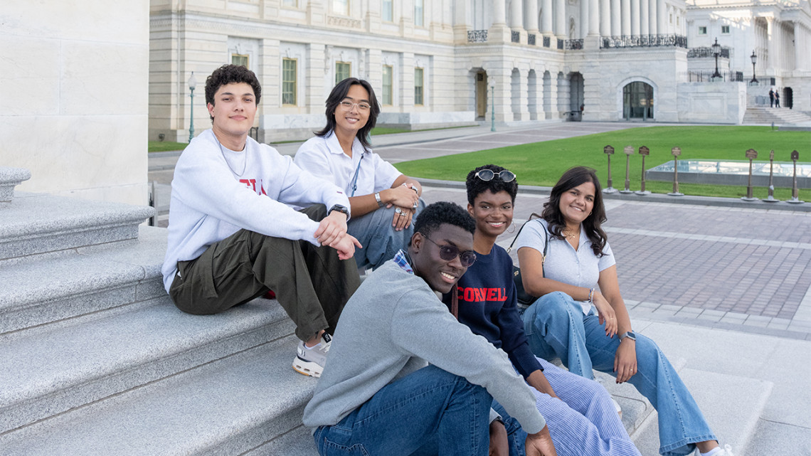 DC Start Scholars sit on the steps of the U.S. Capitol