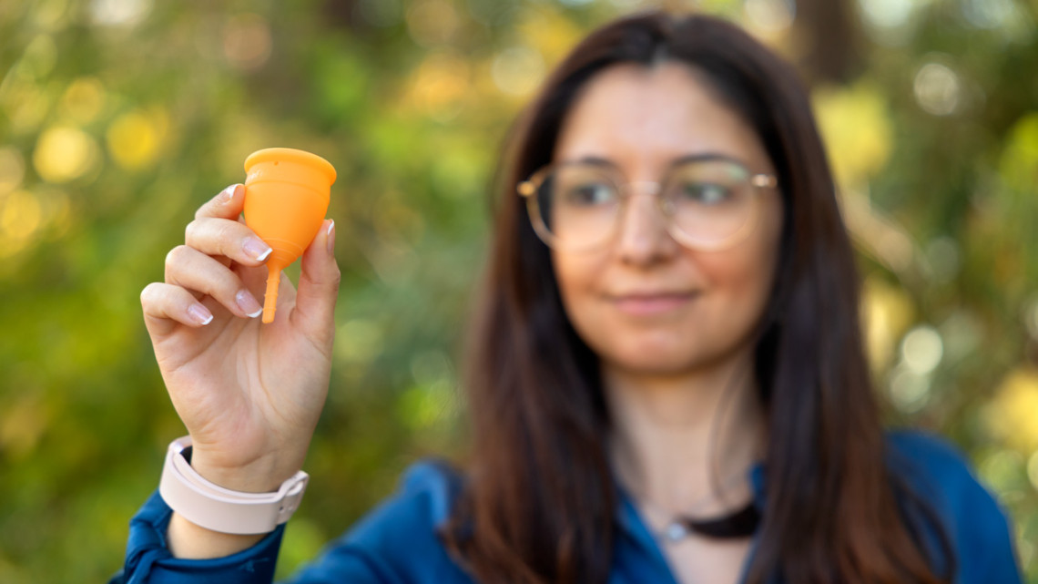 Ligia Coelho, a Postdoctoral Fellow in astronomy in the College of Arts and Sciences and fellow at the Carl Sagan Institute, holds a menstrual cup.