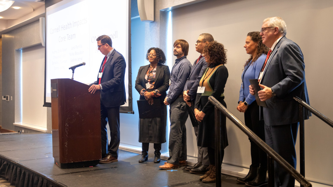 ONE Cornell Award recipients on stage at the President’s Awards for Employee Excellence in the Statler Ballroom, Dec. 3