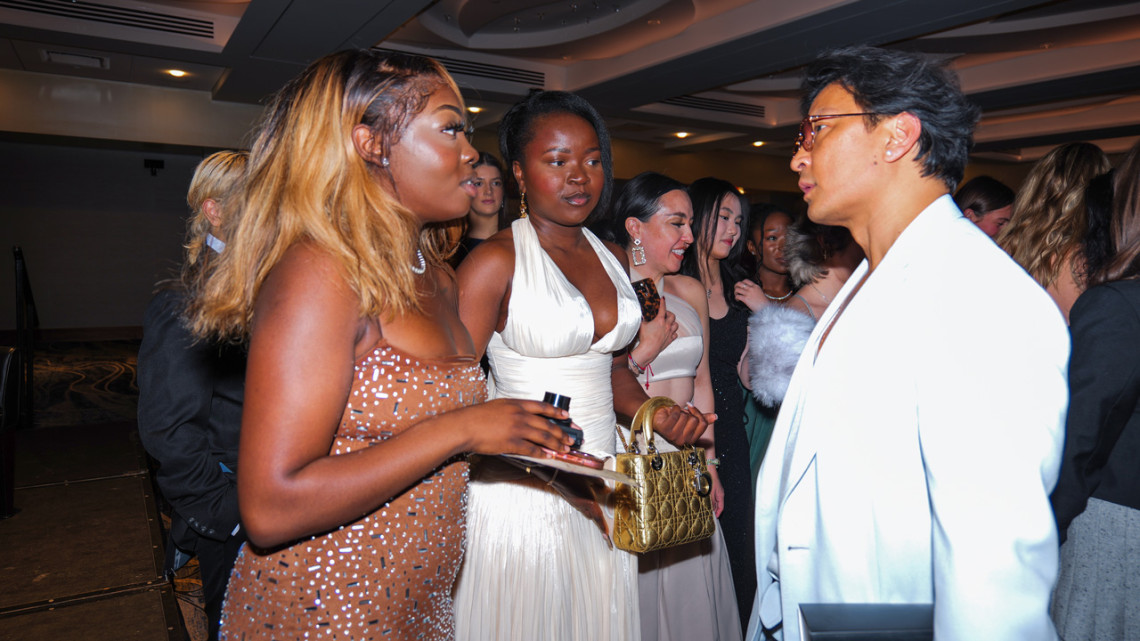 Students network with Prabal Gurung (right), creative director of his namesake label. 