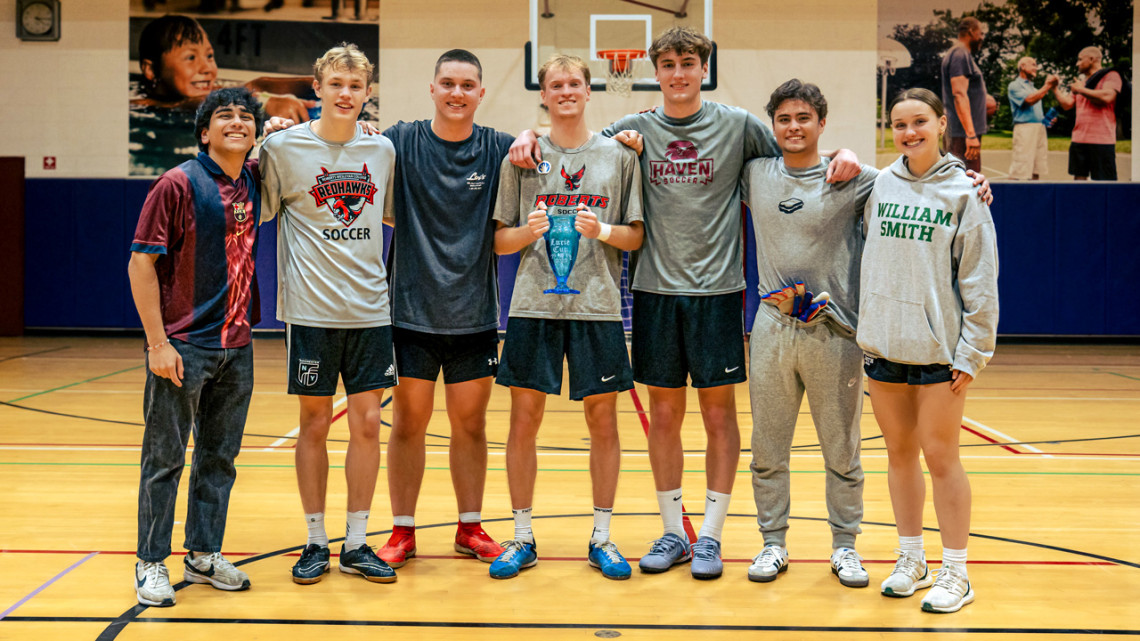 Rohan Amin ’29 (far left), a global development major in the Cornell CALS Ashley School of Global Development and the Environment, poses with winners of the 2025 Lurie Cup on Dec. 27. A team of alumni from Amin’s high school, Corning-Painted Post, took first place.