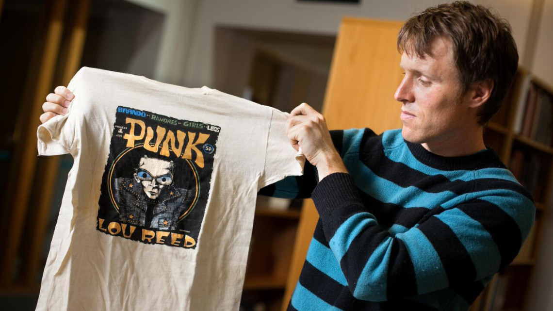 Tom McEnaney in Kroch Library with the Punk Rock Collection in 2012.
