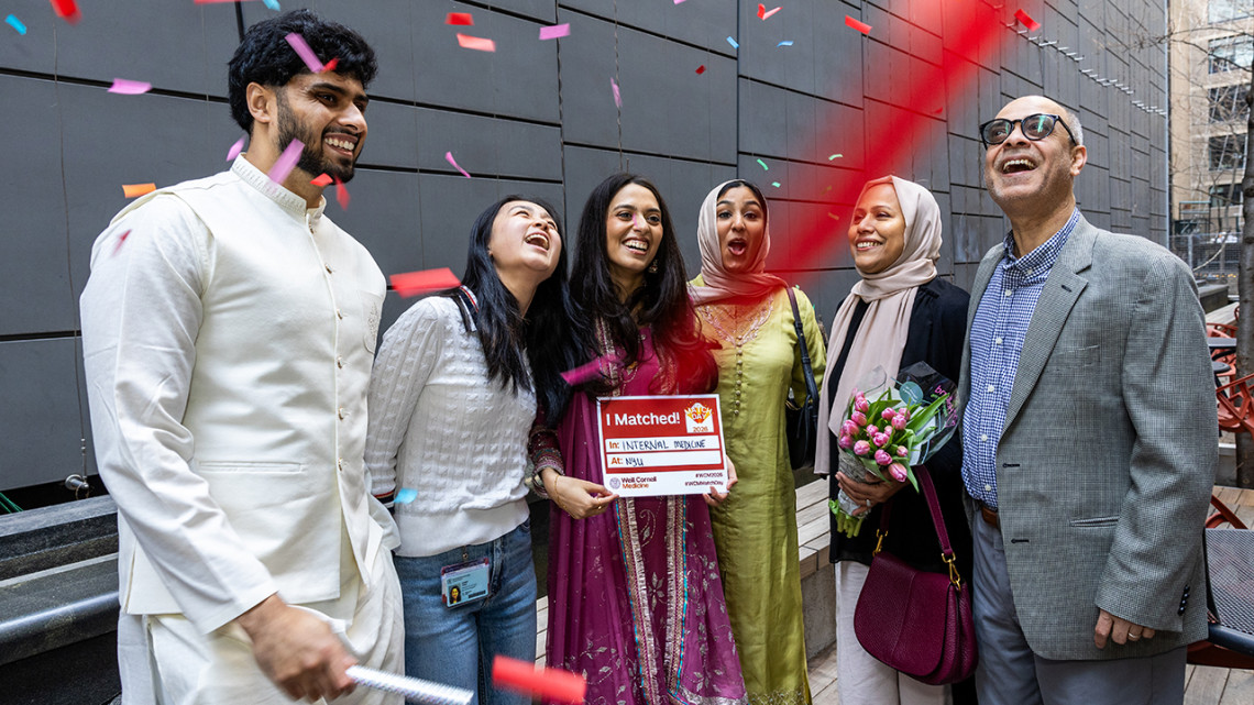 Sarah Chowdhury, center, celebrates with her family after she was matched to NYU Grossman School of Medicine for internal medicine.