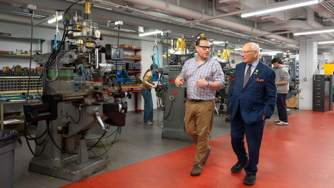 Vincent Chicone, left, director of the Manufacturing Learning Studio, speaks with U.S. Rep. Paul Tonko in the Autodesk Design and Make Space in Upson Hall.