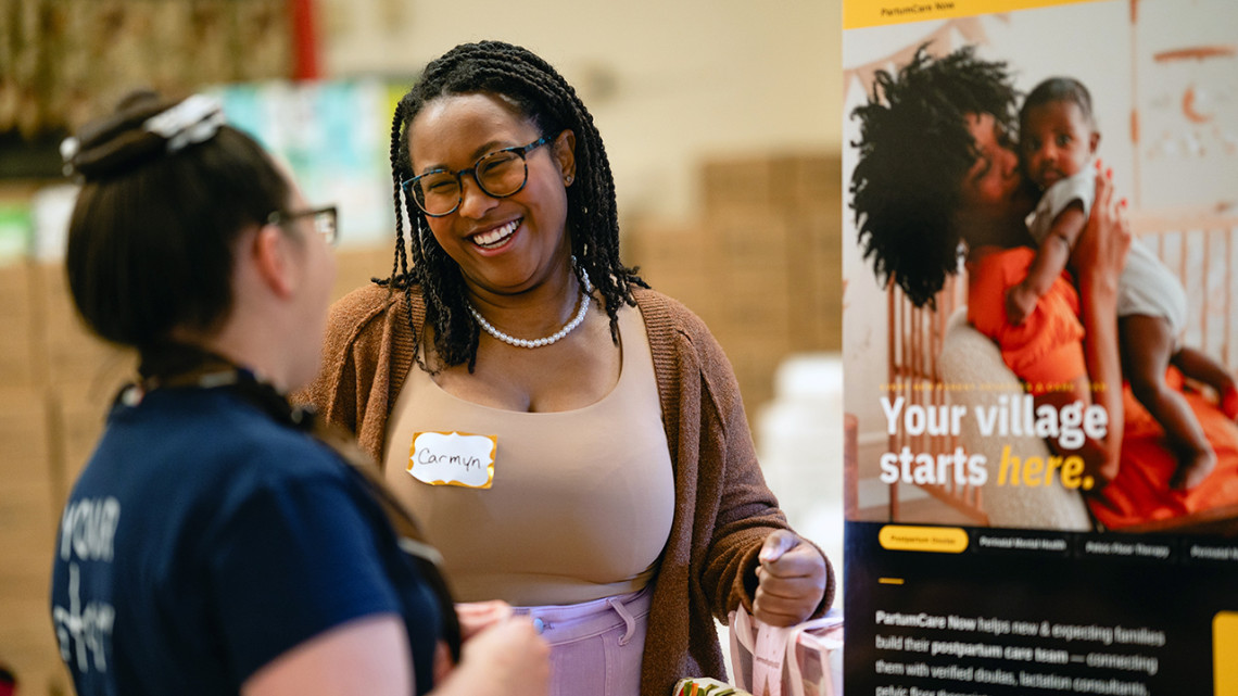 Carmyn Polk, MBA ’26, presents PartumCare Now to an attendee.