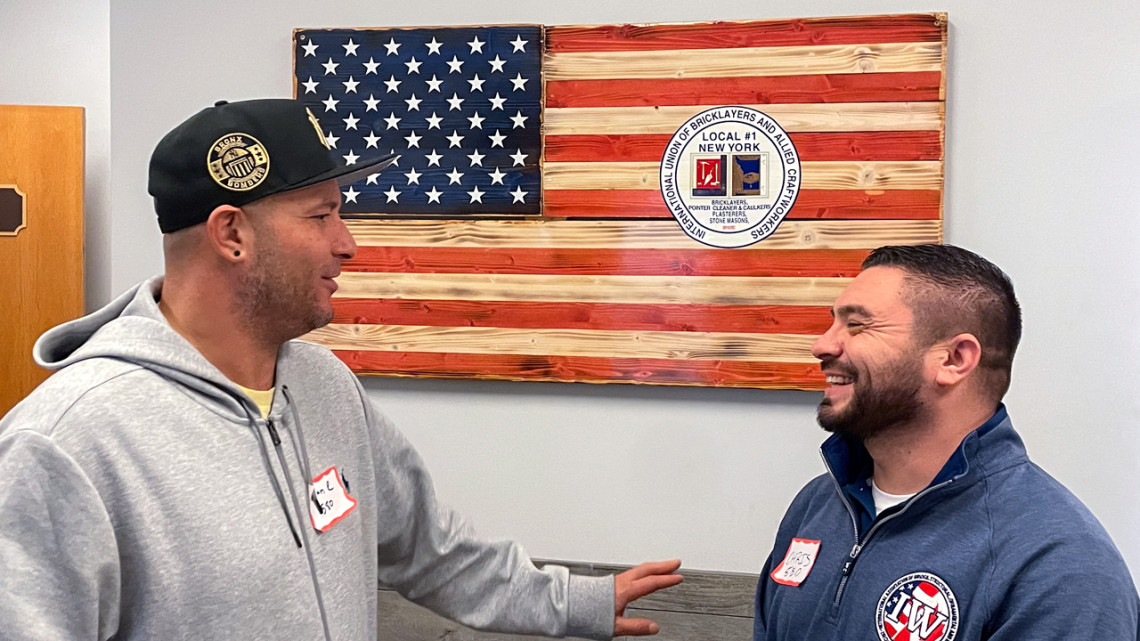 Chris Scattone (right), member assistance program director at the Ornamental and Architectural Ironworkers Union Local 580, talks with union member Brian Romanger at a peer-supporter training session.