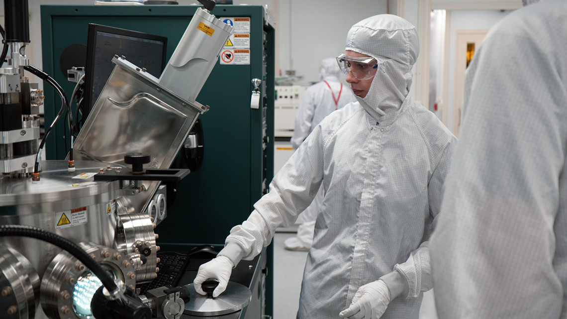 Nathaniel Crispel, a student from the TST-BOCES New Visions Engineering Program, trains with instruments inside the Cornell NanoScale Science and Technology Facility cleanroom.