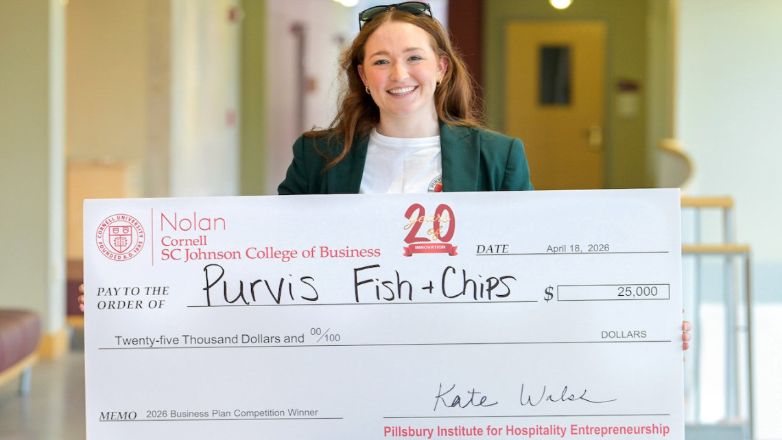 Avery Sheppard holds her first place $25,000 prize.