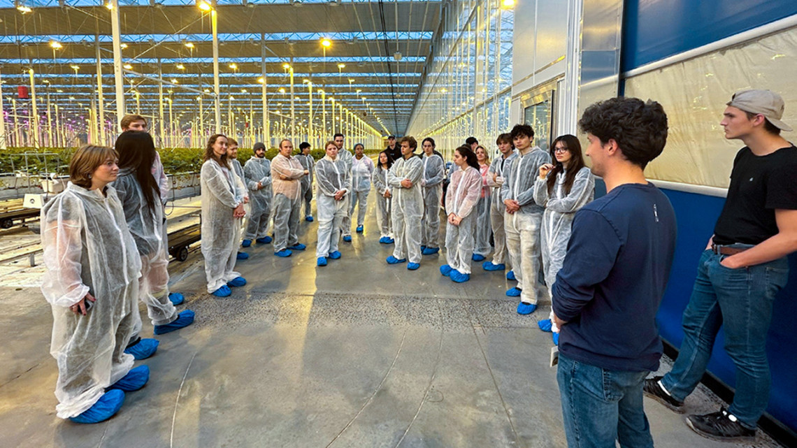 Students in Marvin Pritts’ Berry Crops: Production and Management course visit Green Empire Farms’ 32-acre strawberry greenhouse operation in Oneida, NY. Their protective suits prevent pests and bacteria from entering from the outside. 