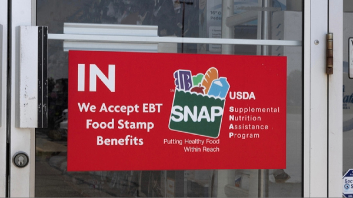 SNAP poster at front door of store.