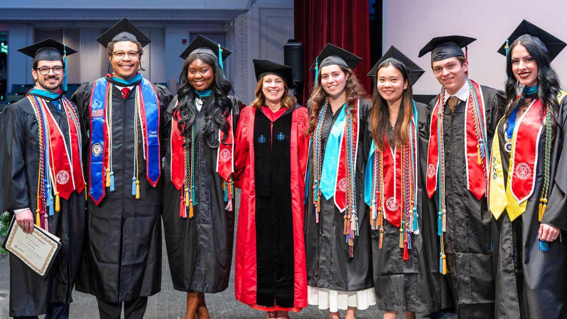 John Siliciano Student Leadership Awardees stand on stage with Dean Colleen Barry, left to right, Paul Caruso MPA '26, Quson Brown MPA '26, Darnisha Augustin MHA '26, Dean Barry, Emily Snider '26, Emma Lin '26, Samuel Stille '26,  Nikki Smith MHA '26