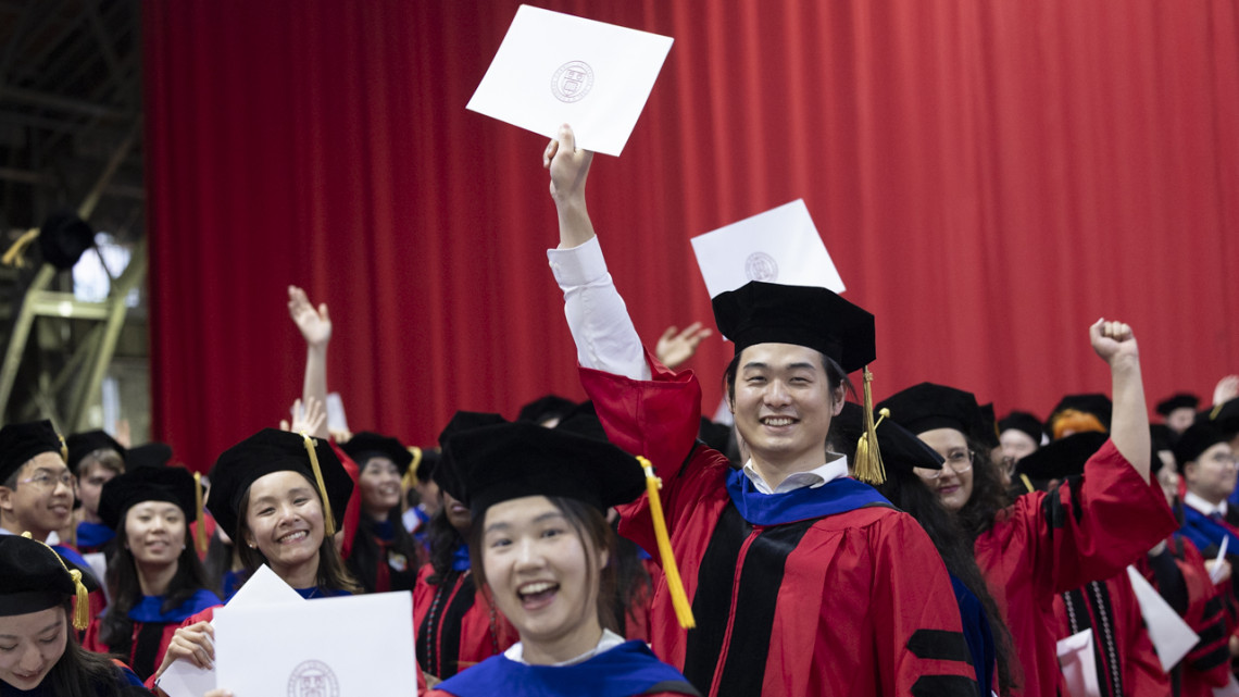 Doctoral candidates celebrate with their degrees during the Ph.D. Recognition Ceremony, held May 22 in Barton Hall.